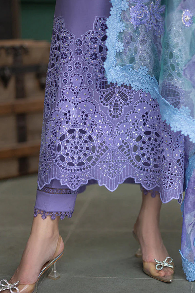 Close-up of a person wearing a purple lace dress with a blurred background
