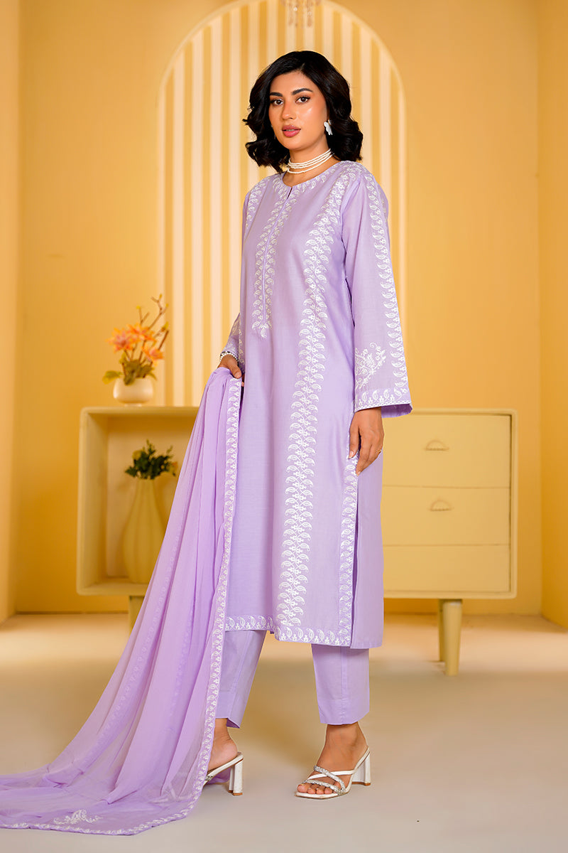 Woman in a light purple traditional outfit with a matching dupatta in a well-lit room.