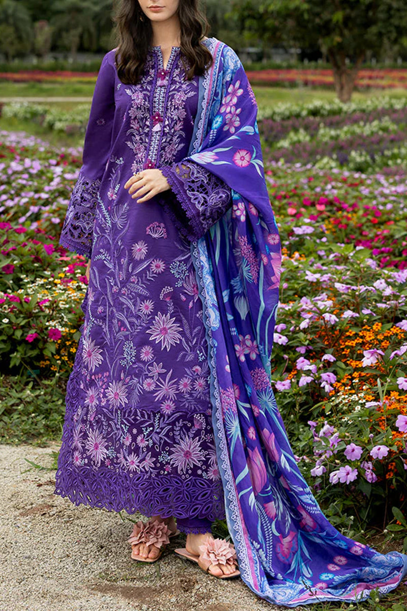 Purple embroidered outfit with a matching dupatta against a floral garden background