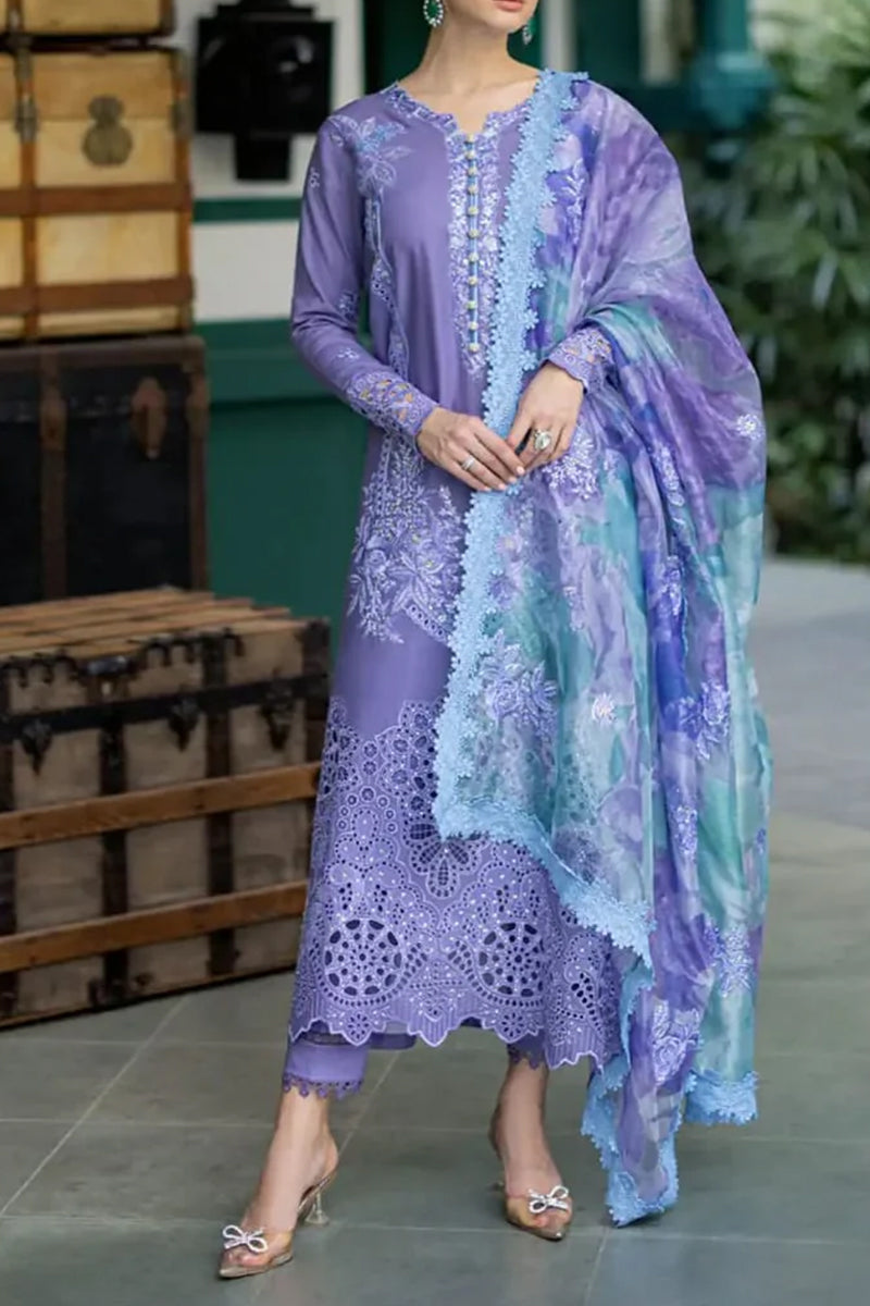Woman wearing a purple lace outfit with a matching shawl in a casual setting.