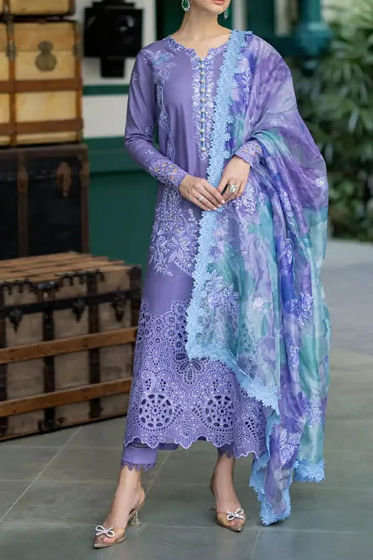 Woman wearing a purple lace outfit with a matching shawl in a casual setting.