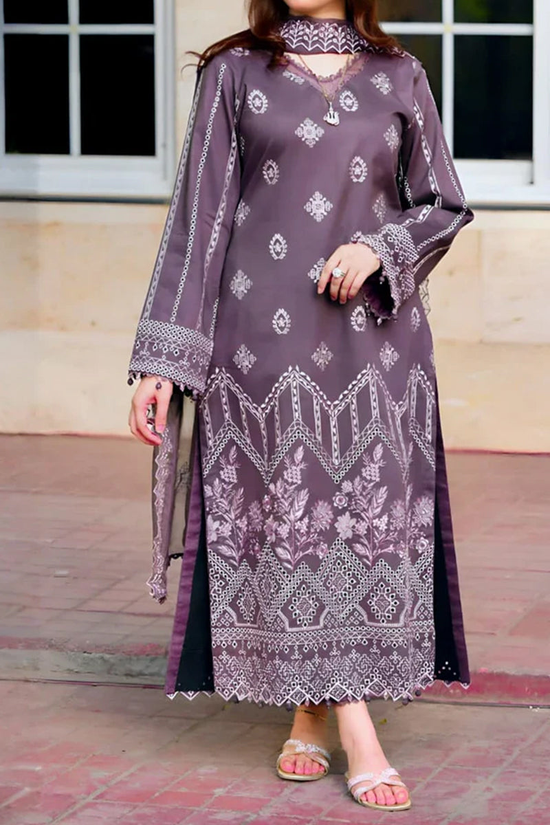 Woman wearing a long, patterned dress with a blurred background