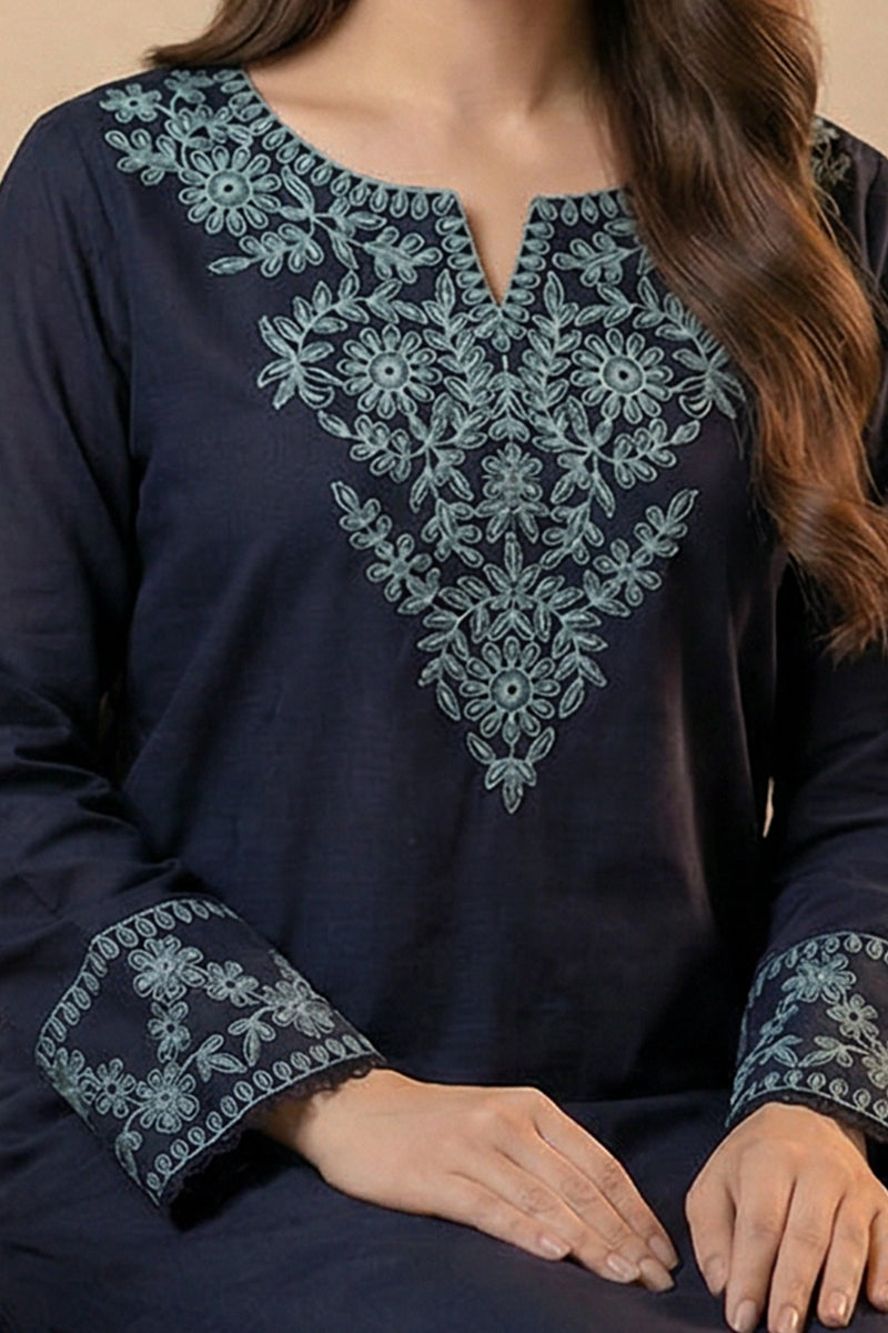 Navy blue embroidered top with intricate patterns on a beige background